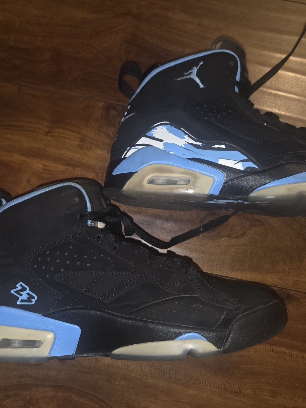 Jordan Men’s Black and University Blue Retro Basketball Sneakers